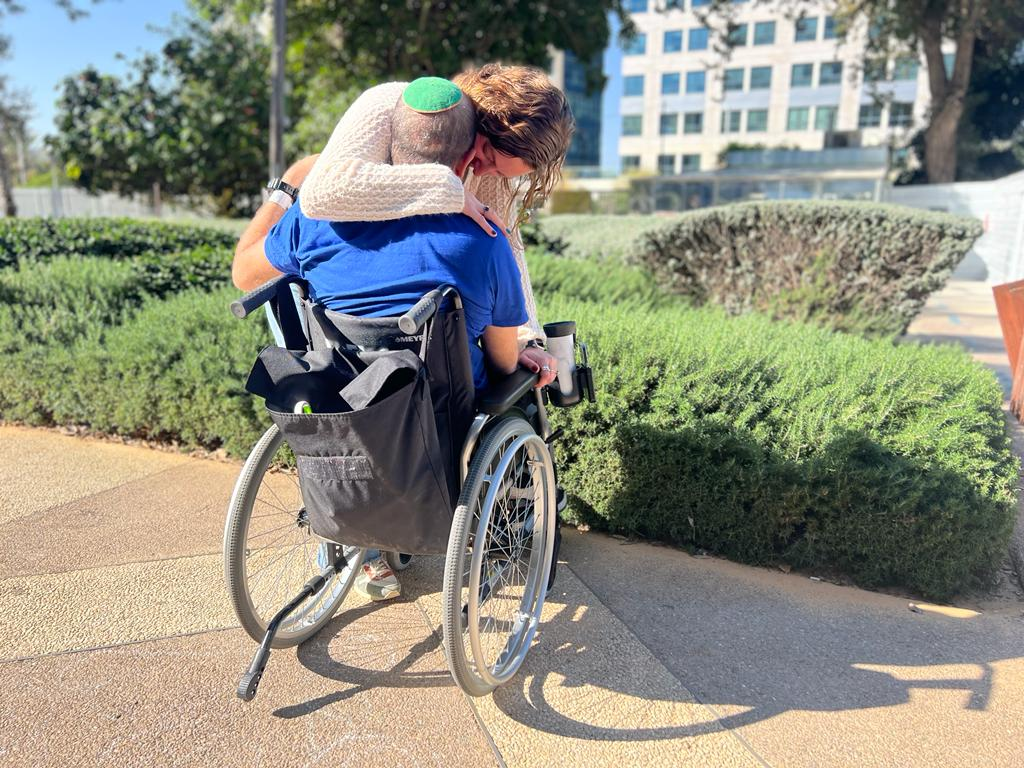 Hug on a wheelchair